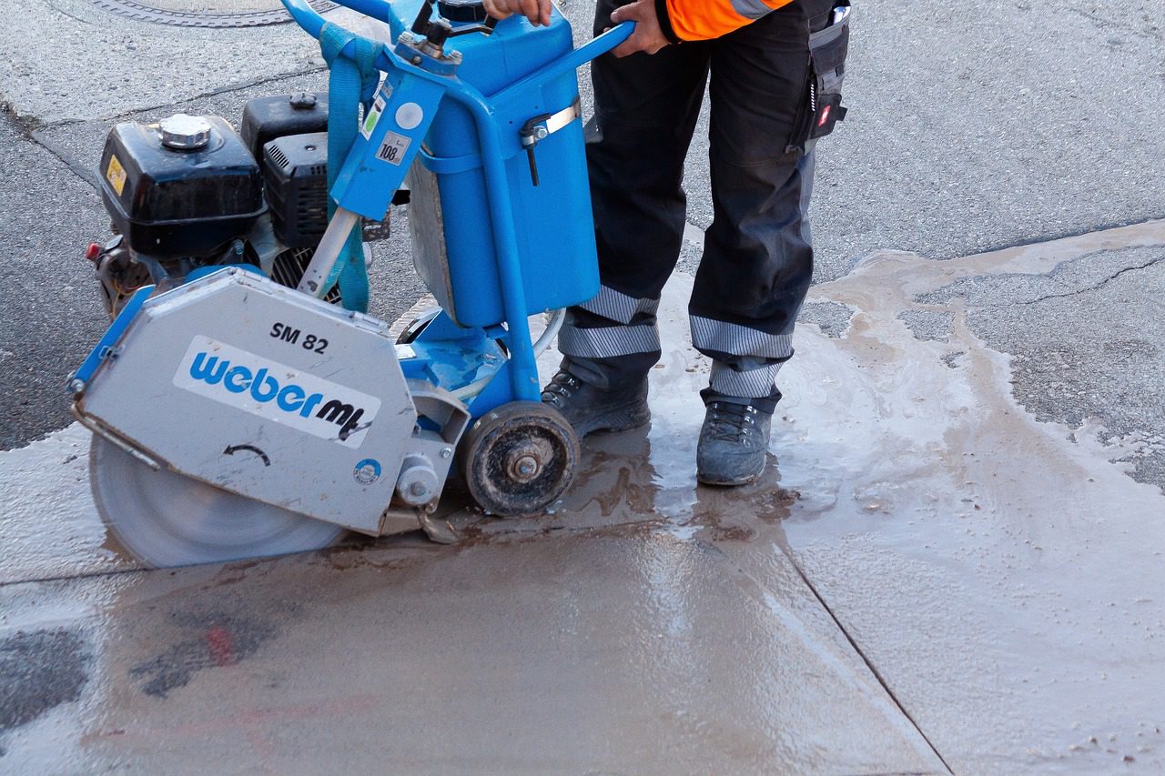 A man cutting concrete for a tenant improvement